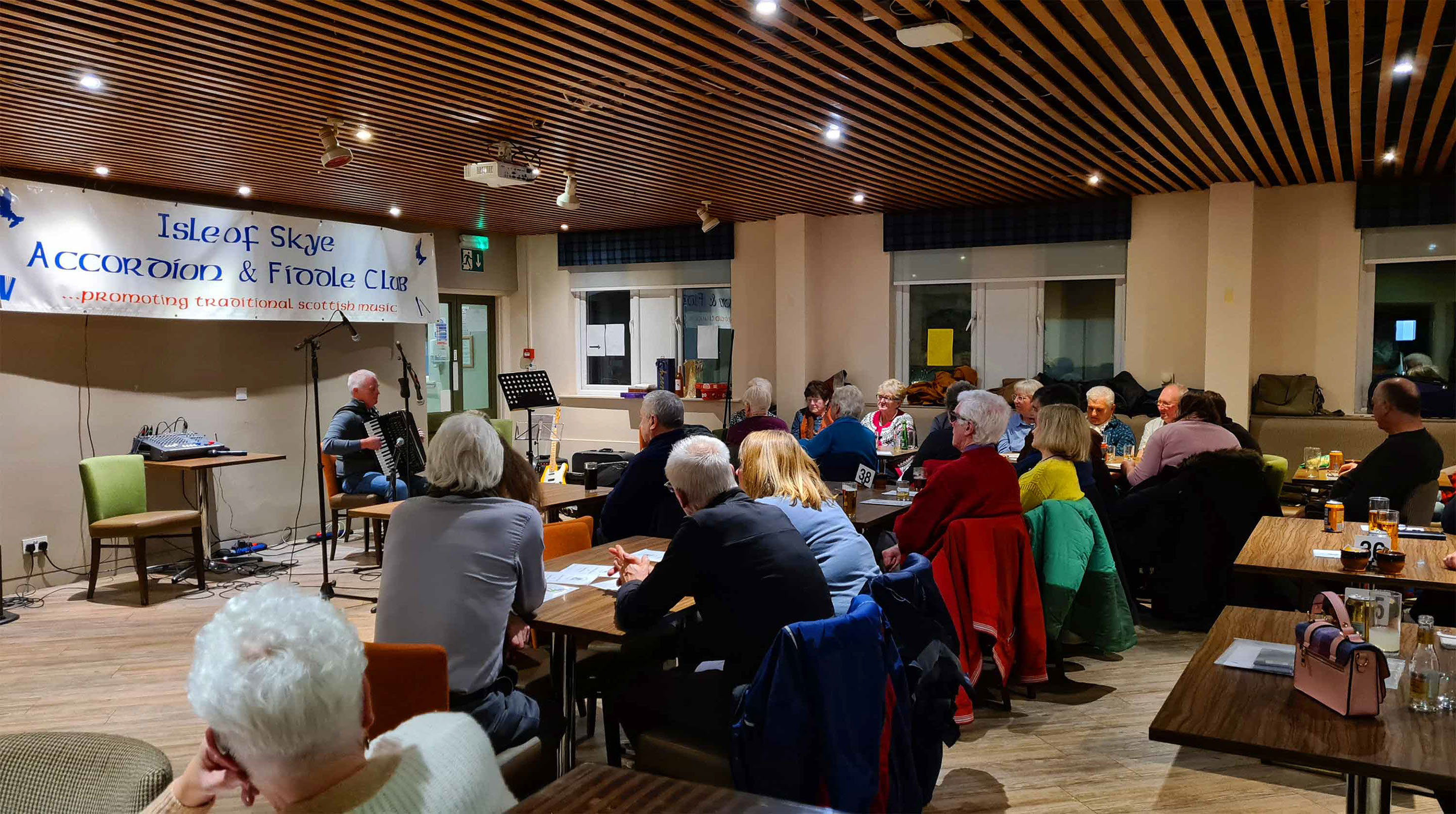 Fiddle player in Portree playing a live performance